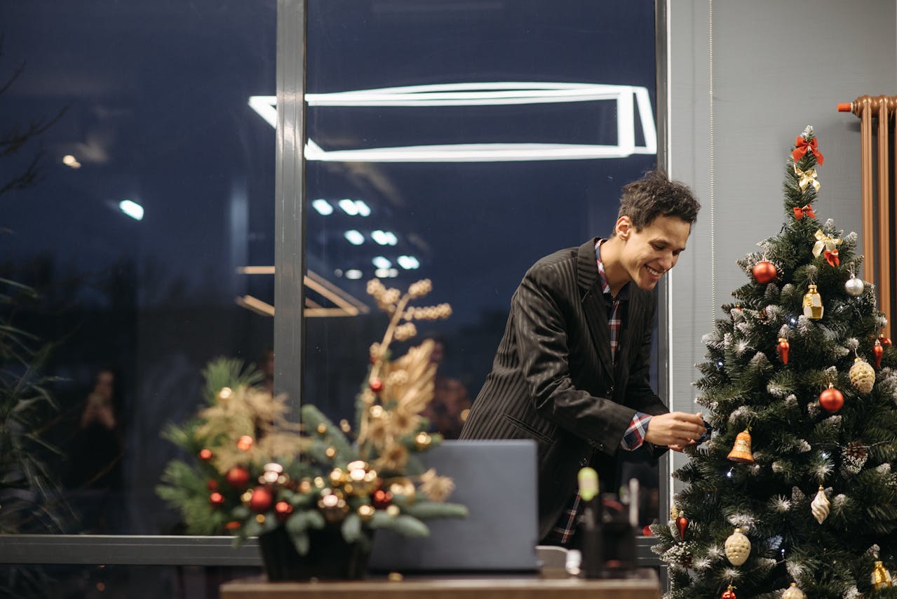 Man decorating the office for Christmas