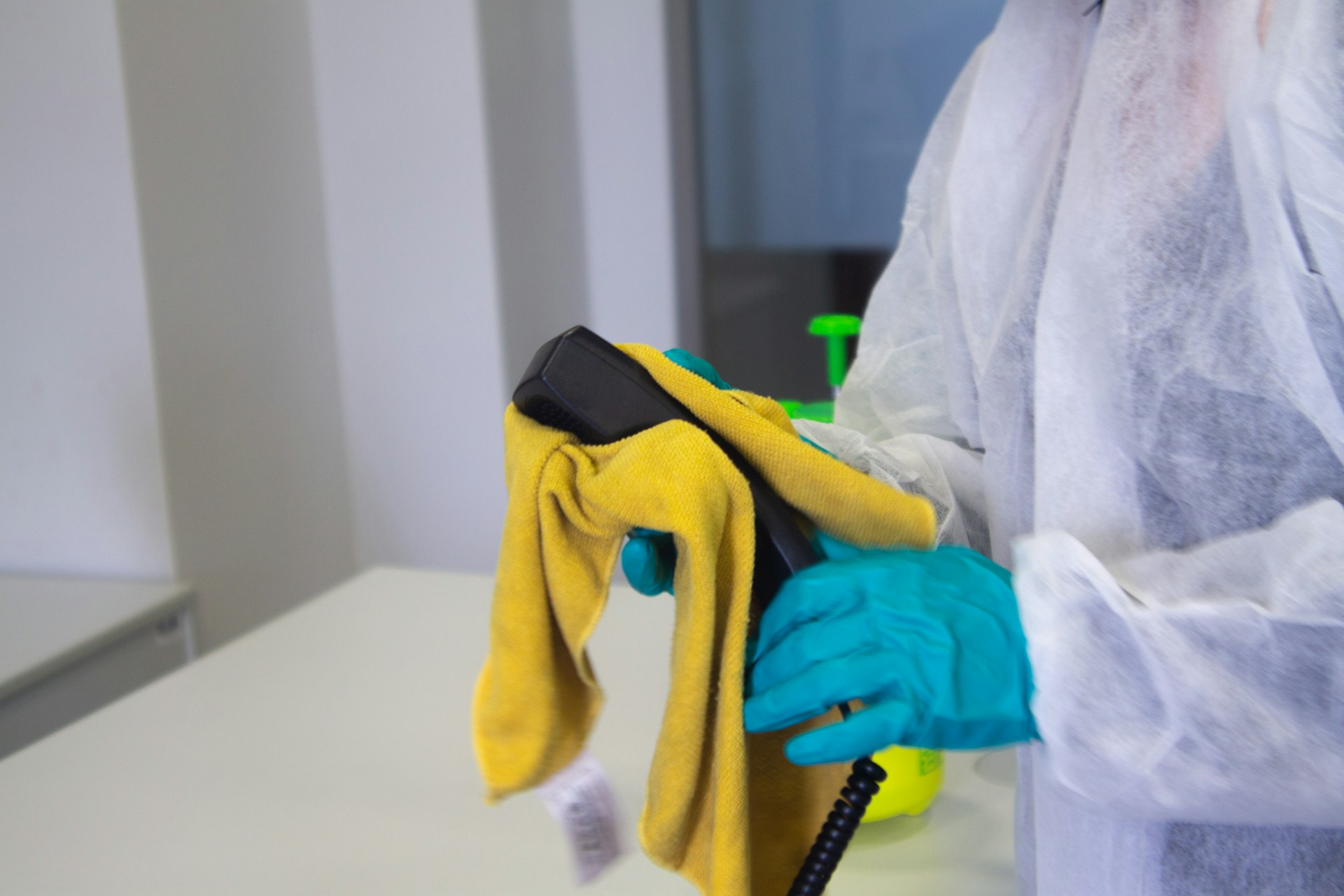 Wiping down a phone to clean