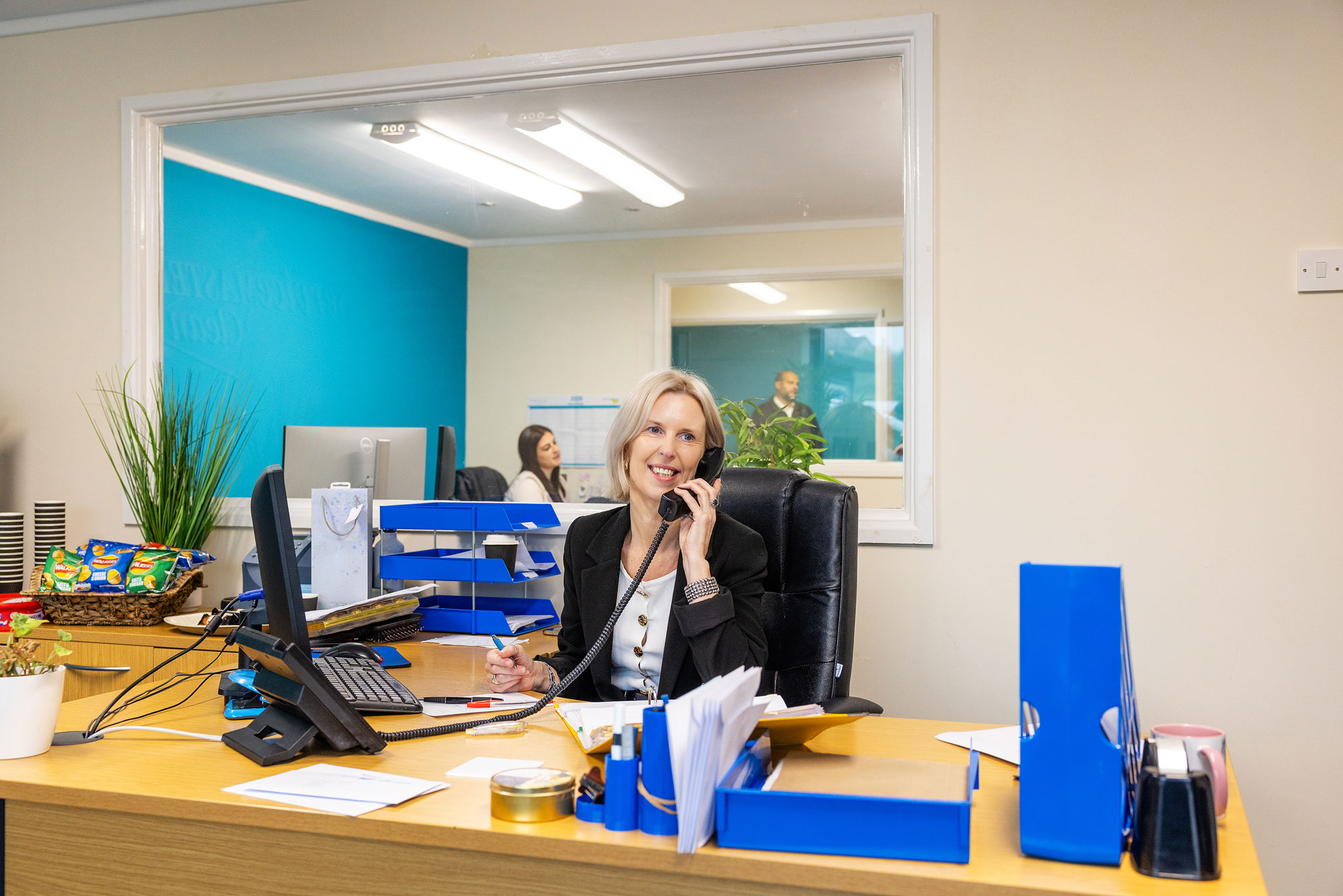 woman in office taking a phone call